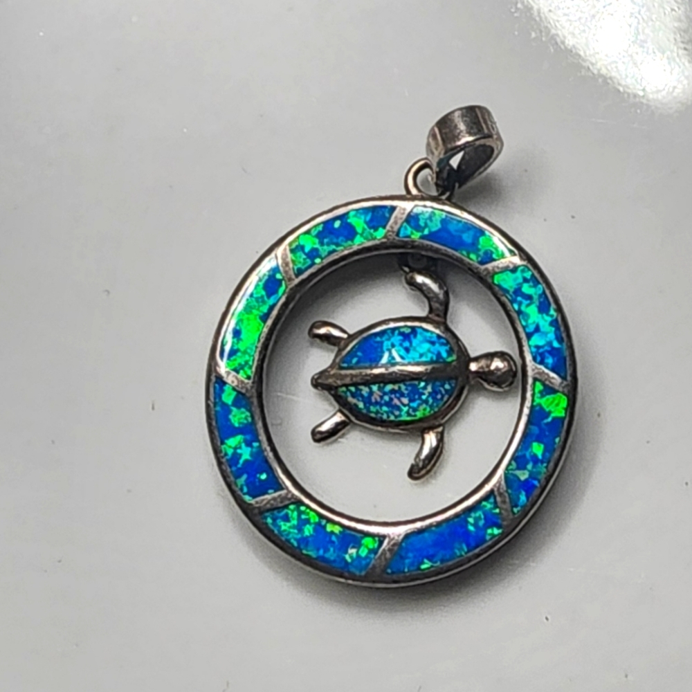 Opal and silver turtle pendant